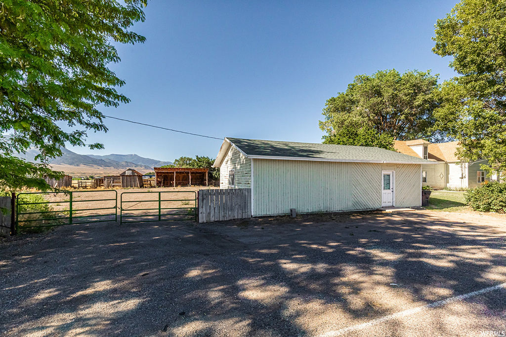 View of property exterior with a mountain view