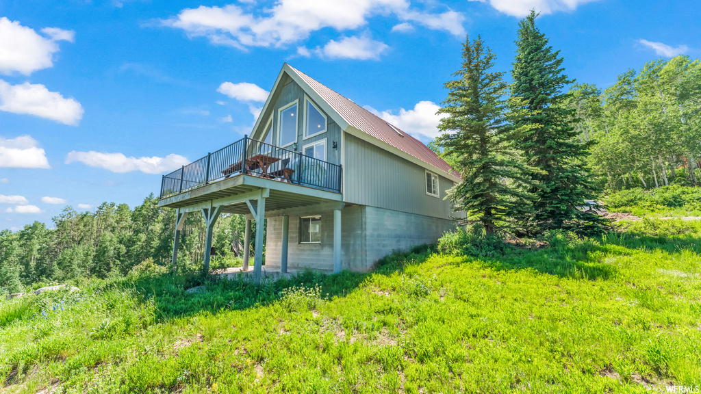 View of home\'s exterior with a lawn