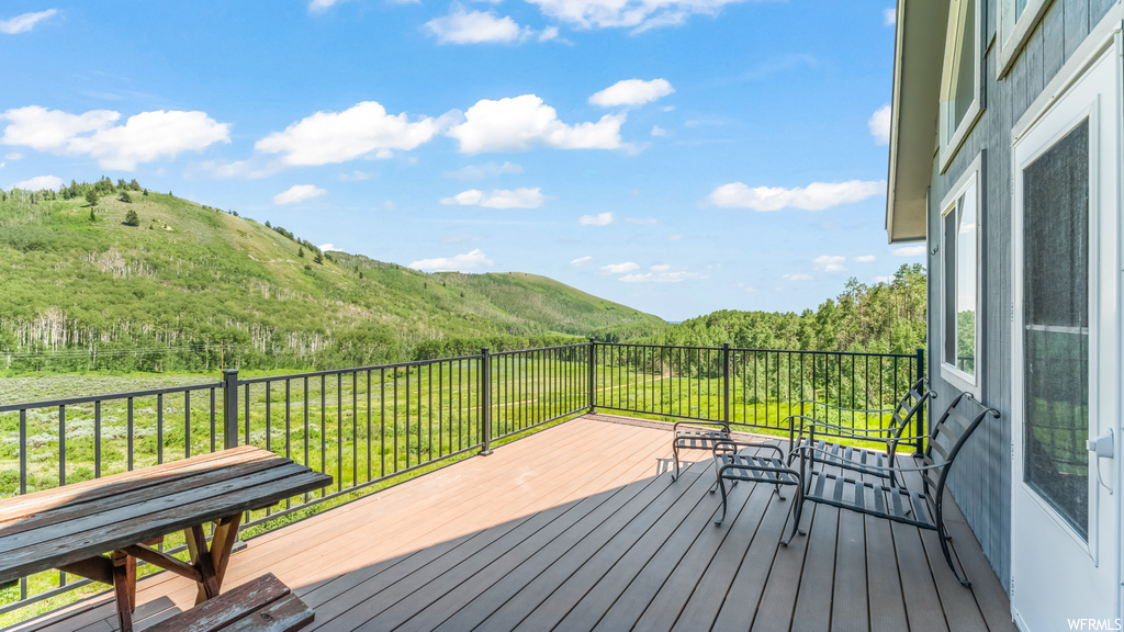 Deck featuring a yard