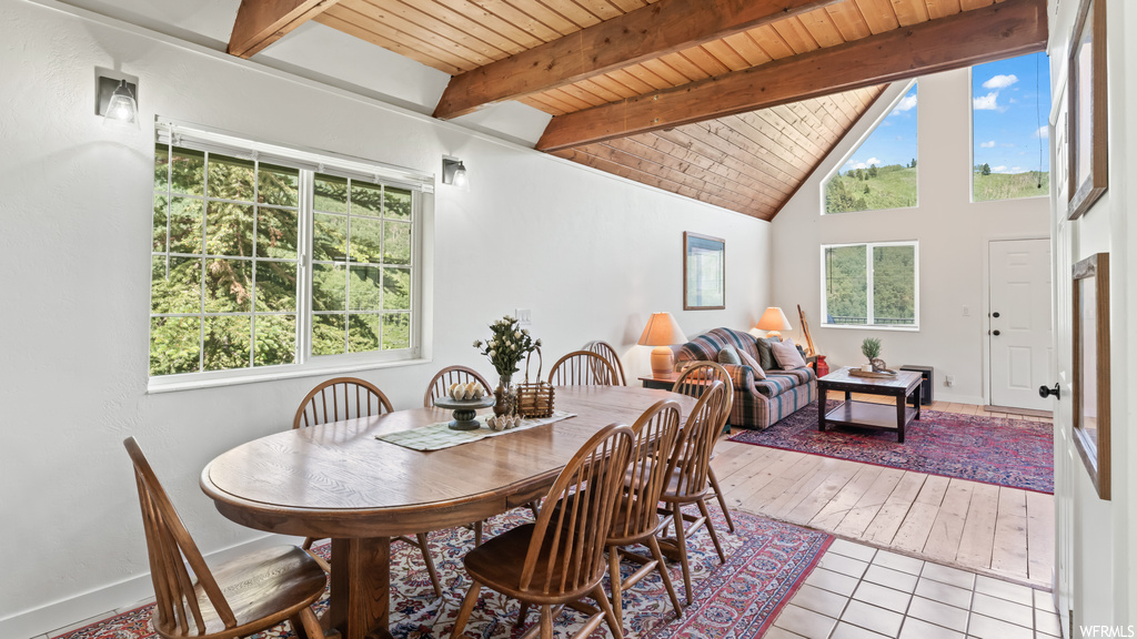 Dining area featuring natural light and lofted ceiling
