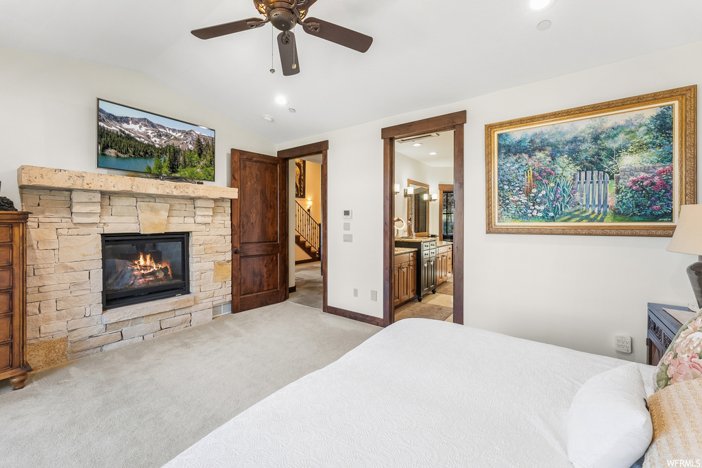 Bedroom with a fireplace, a ceiling fan, carpet, and TV