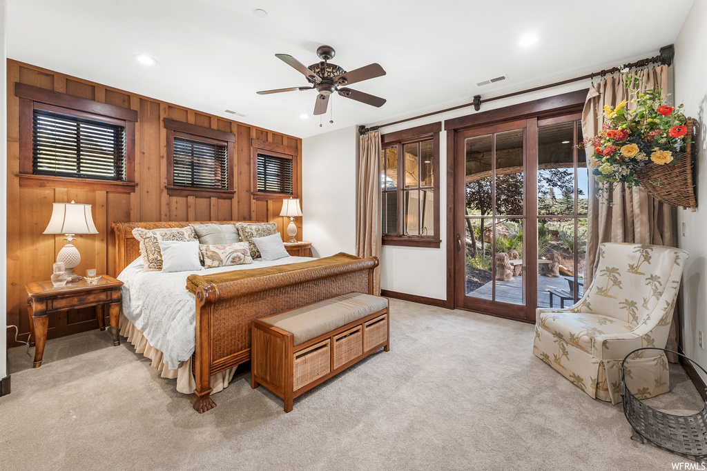 Bedroom with natural light, a ceiling fan, and carpet