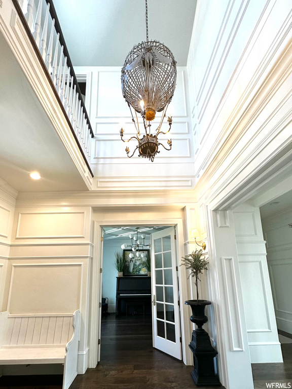 Hallway featuring a notable chandelier