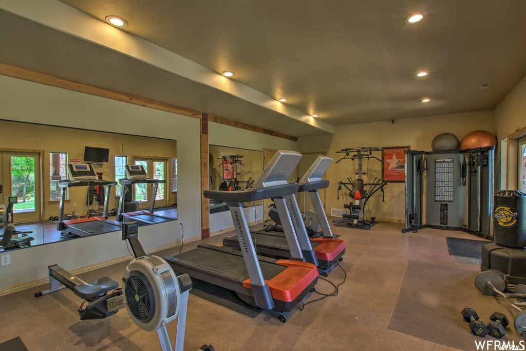 Workout room with natural light and TV