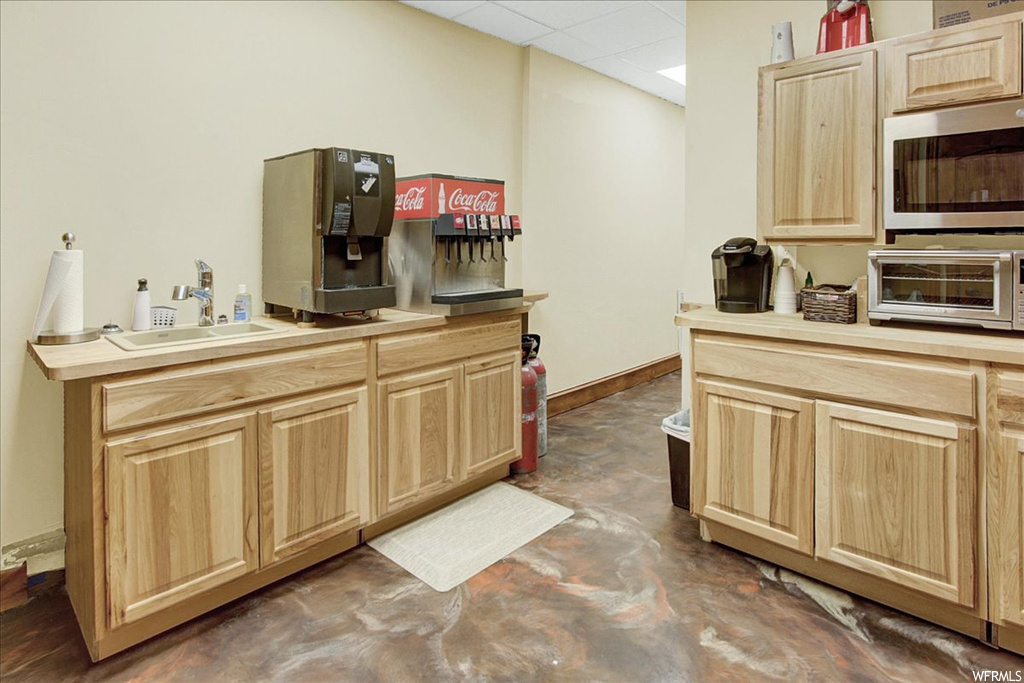Kitchen featuring microwave and light countertops