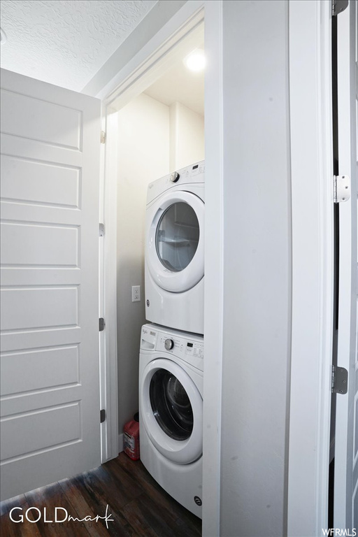 Laundry room featuring hardwood floors and independent washer and dryer