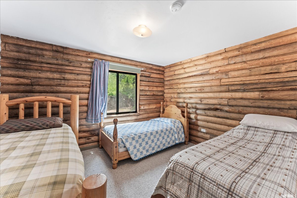 Bedroom with natural light and carpet