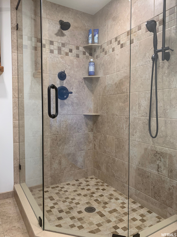 Bathroom featuring shower with shower door