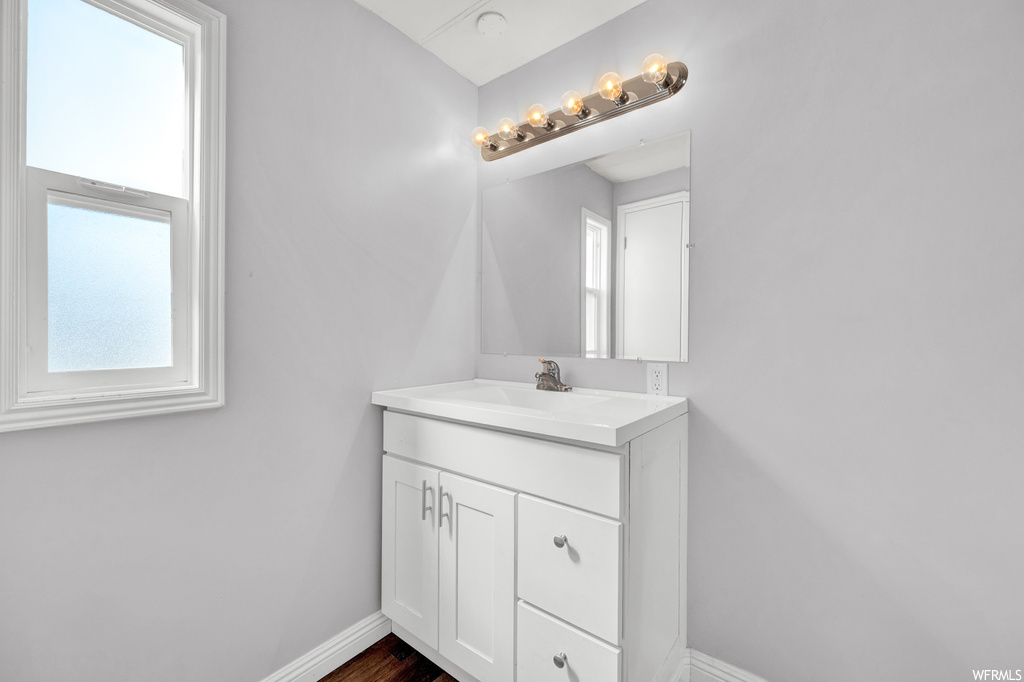 Bathroom with mirror and large vanity