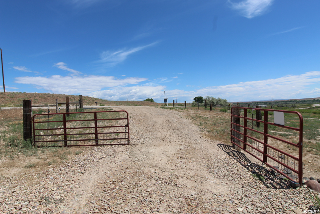 View of gate featuring a rural view