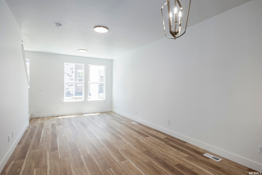 Spare room featuring light parquet floors