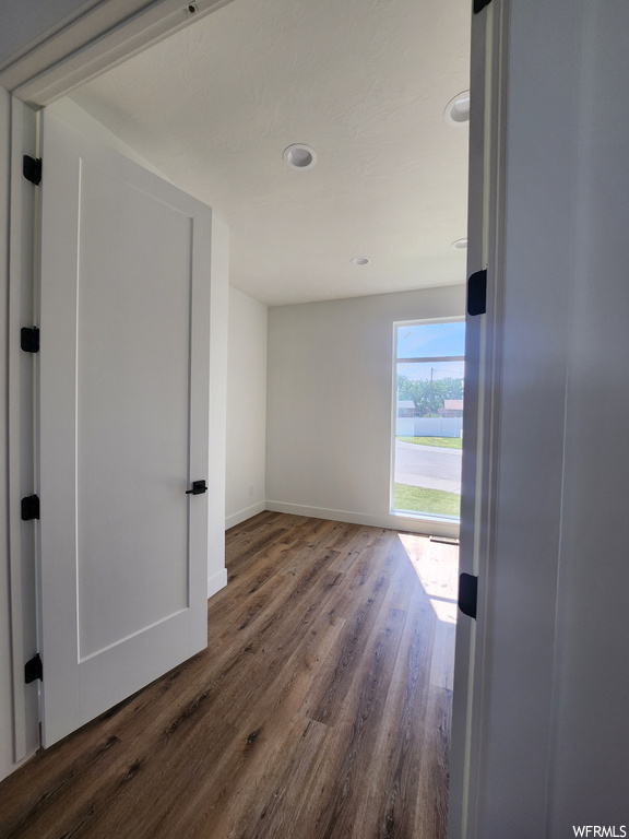 Hallway featuring light hardwood flooring