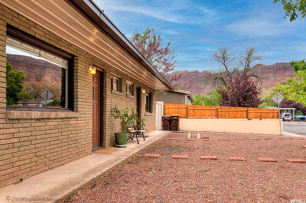 View of yard featuring a patio and a mountain view