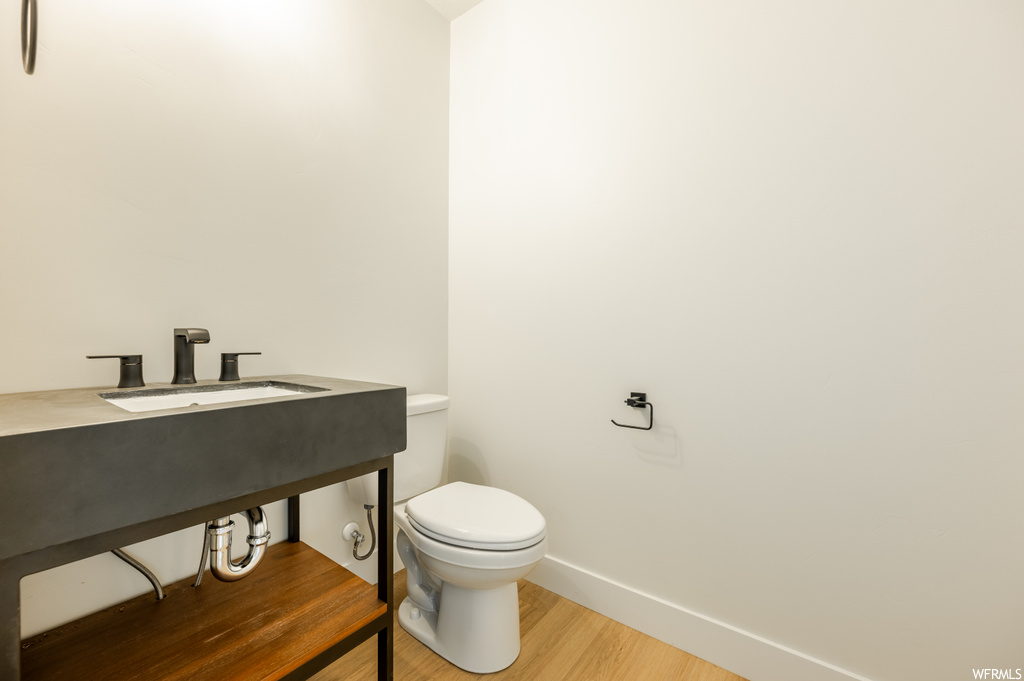 Bathroom featuring vanity and light hardwood floors