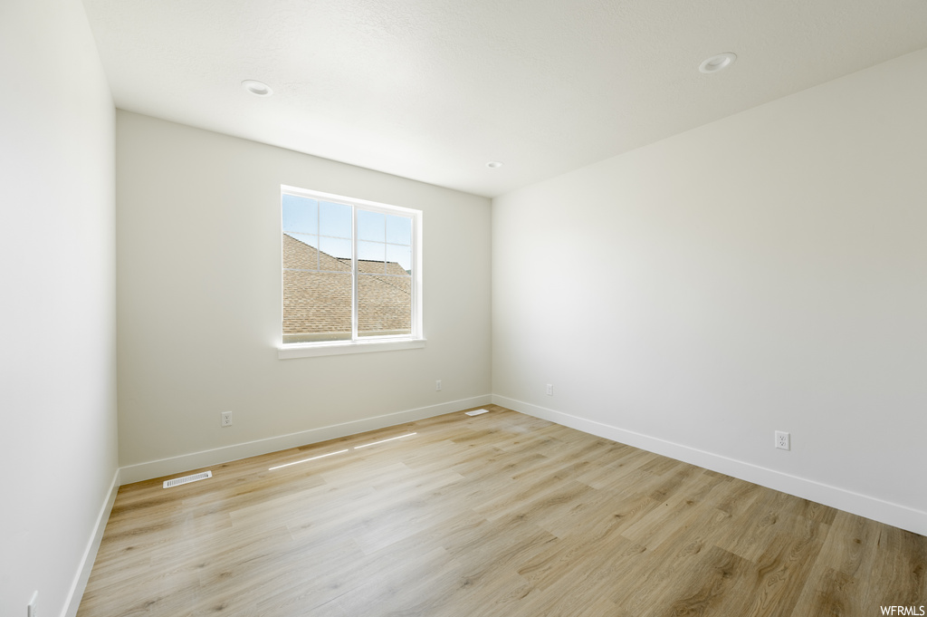 Spare room with light hardwood floors