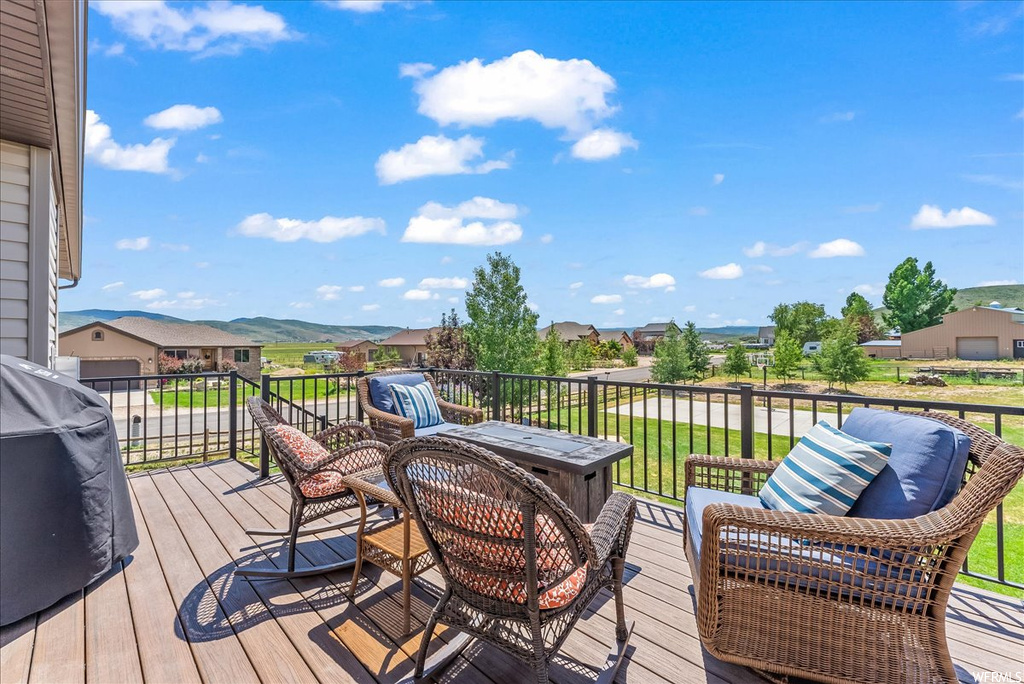 Wooden terrace with a lawn
