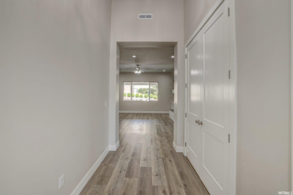 Corridor featuring light hardwood flooring