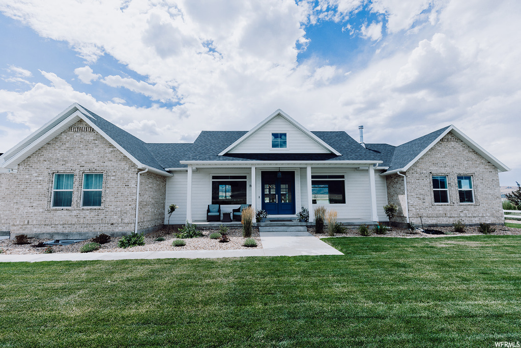 View of front of house with a front lawn