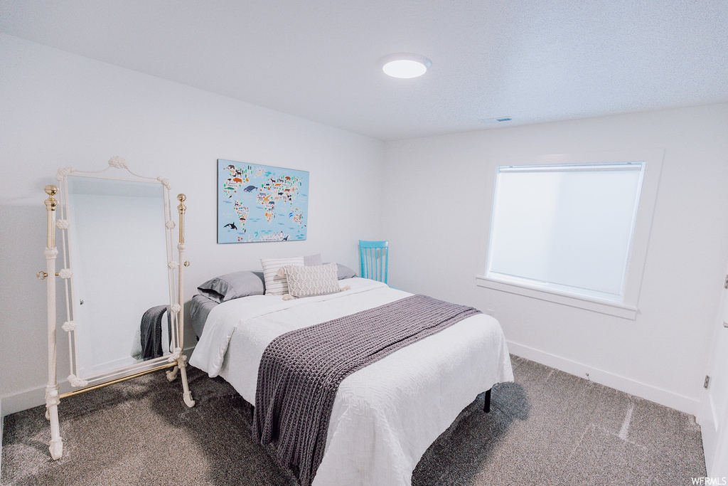Bedroom featuring carpet flooring