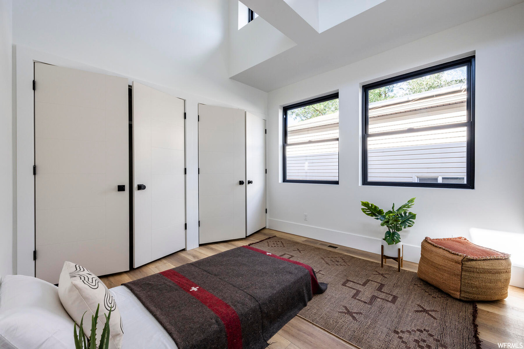 Bedroom with light hardwood flooring