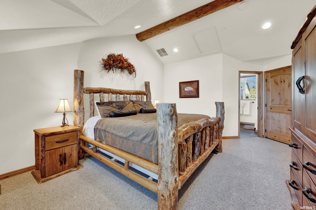 Bedroom with light carpet and vaulted ceiling with beams