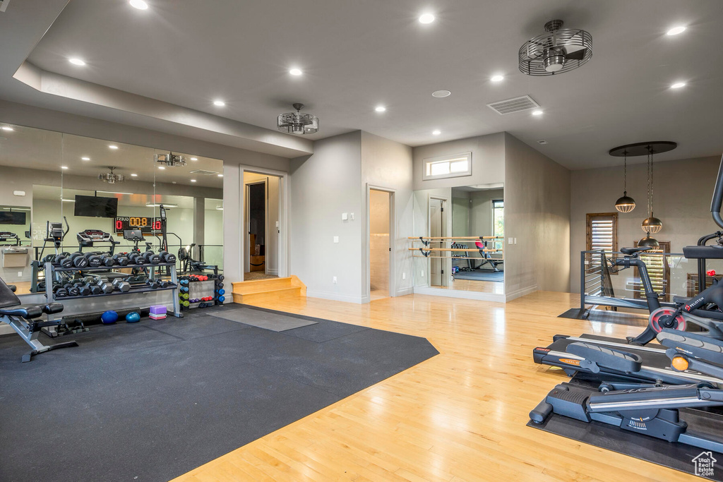 Workout area featuring light hardwood / wood-style flooring