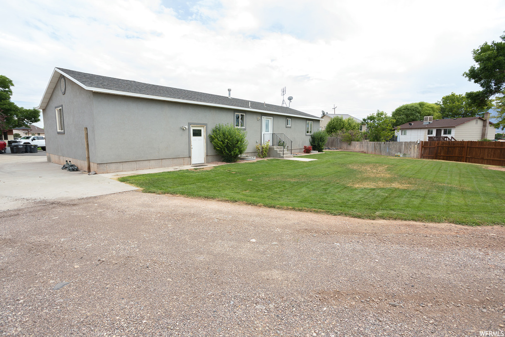 View of front of property featuring a front lawn