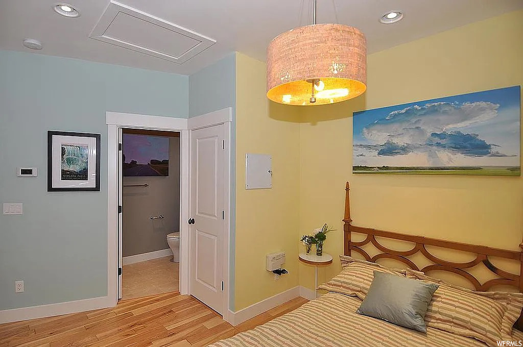 Bedroom featuring light hardwood flooring