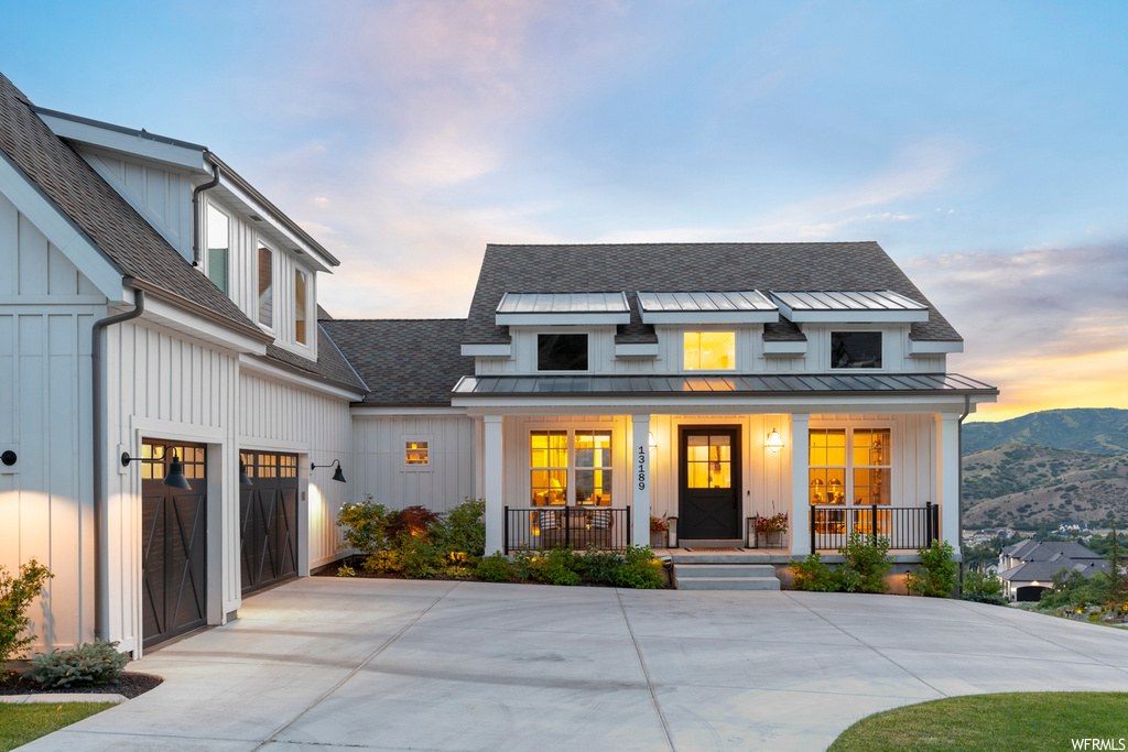 Modern farmhouse with a porch and garage