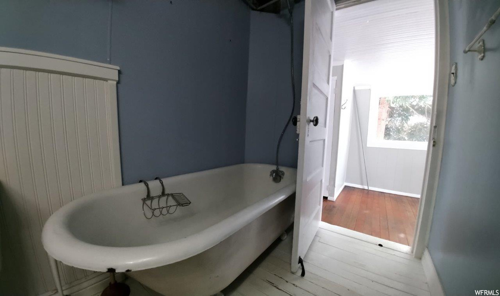 Bathroom featuring light hardwood floors