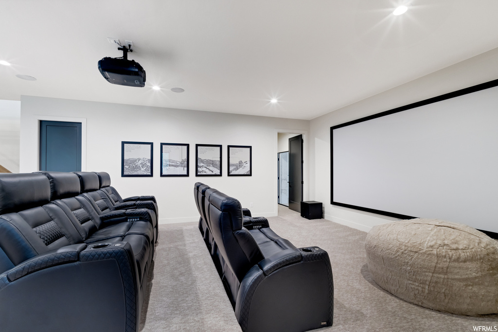 Home theater featuring light carpet