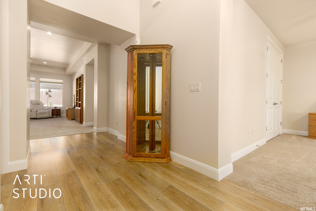 Hall with light hardwood flooring
