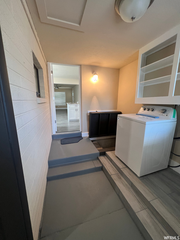 Laundry area featuring washer / dryer and hardwood floors