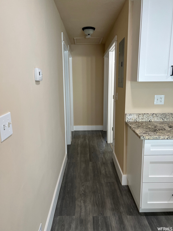 Corridor featuring dark hardwood floors