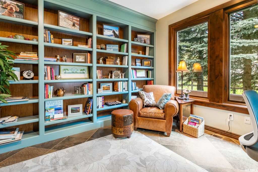 Living area with light tile floors