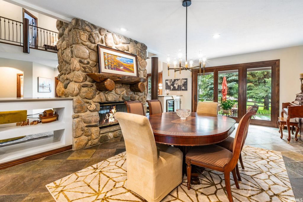 Dining room featuring a fireplace and tile floors