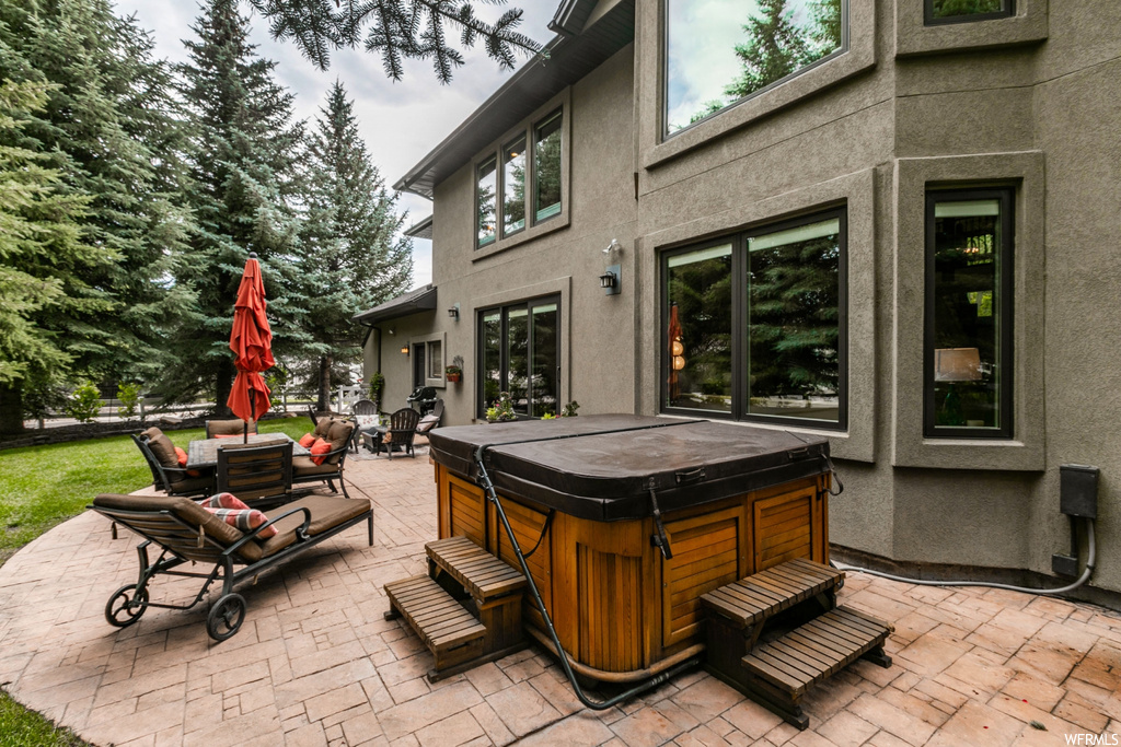 View of patio / terrace with hot tub