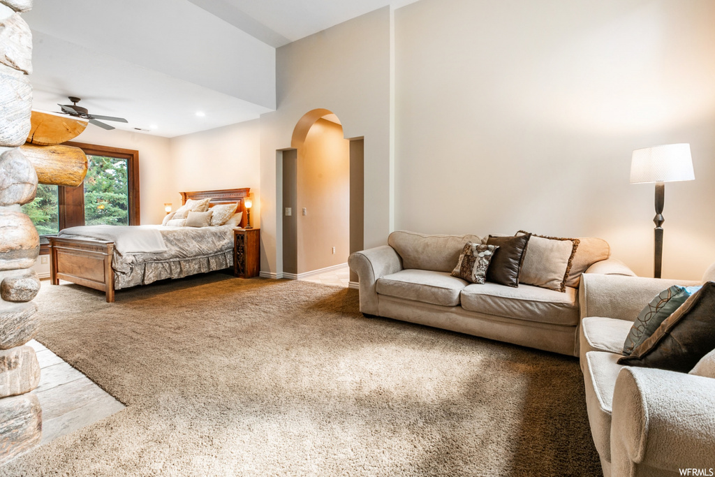 Bedroom with light carpet and ceiling fan