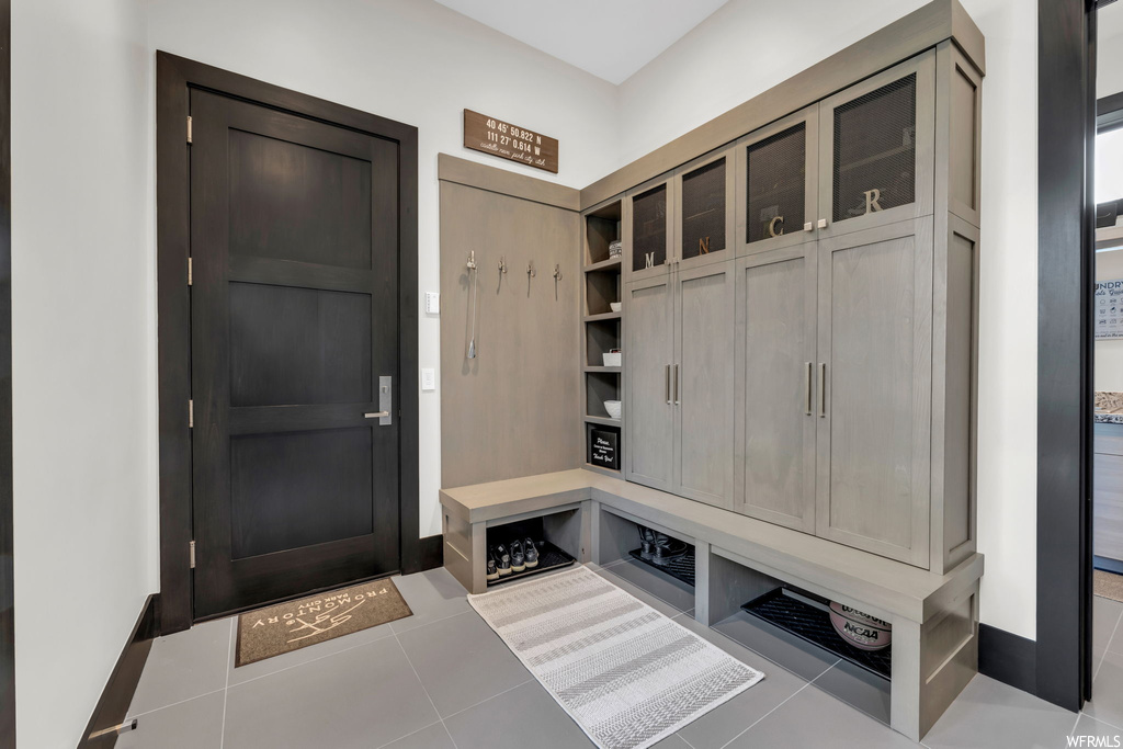 Mudroom with light tile flooring