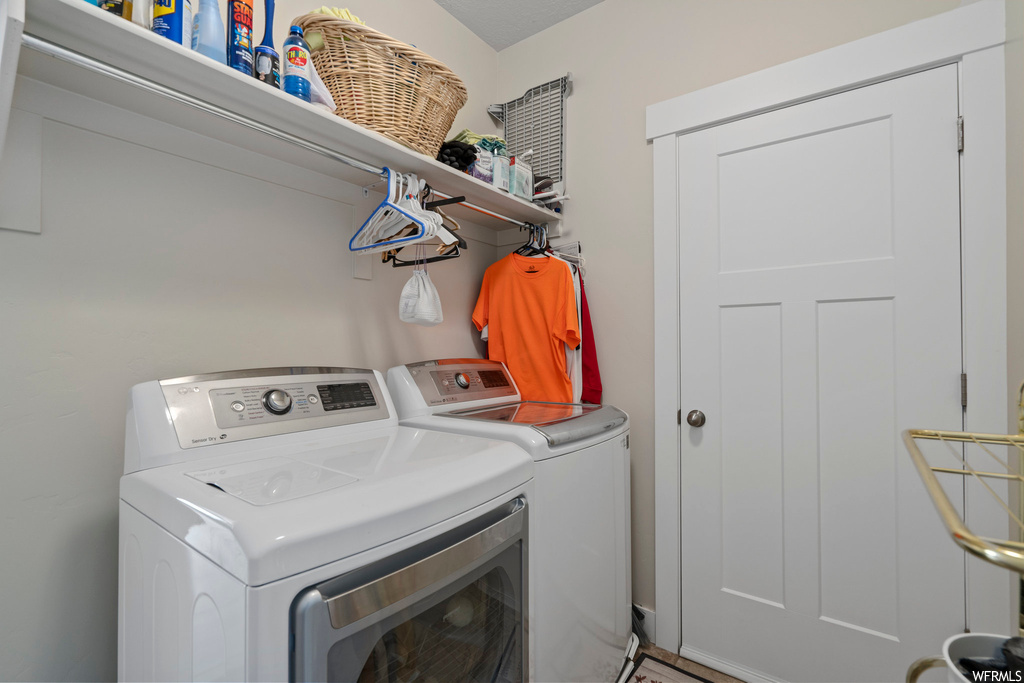 Washroom featuring separate washer and dryer