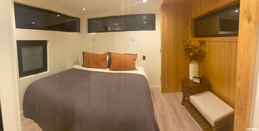 View of hardwood floored bedroom