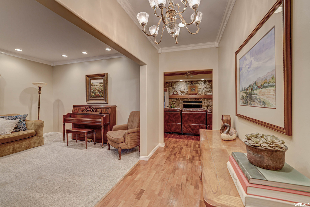 Interior space featuring light parquet floors and crown molding