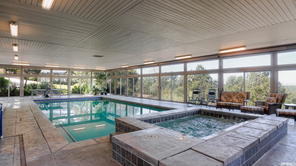 View of swimming pool with an outdoor living space and a patio