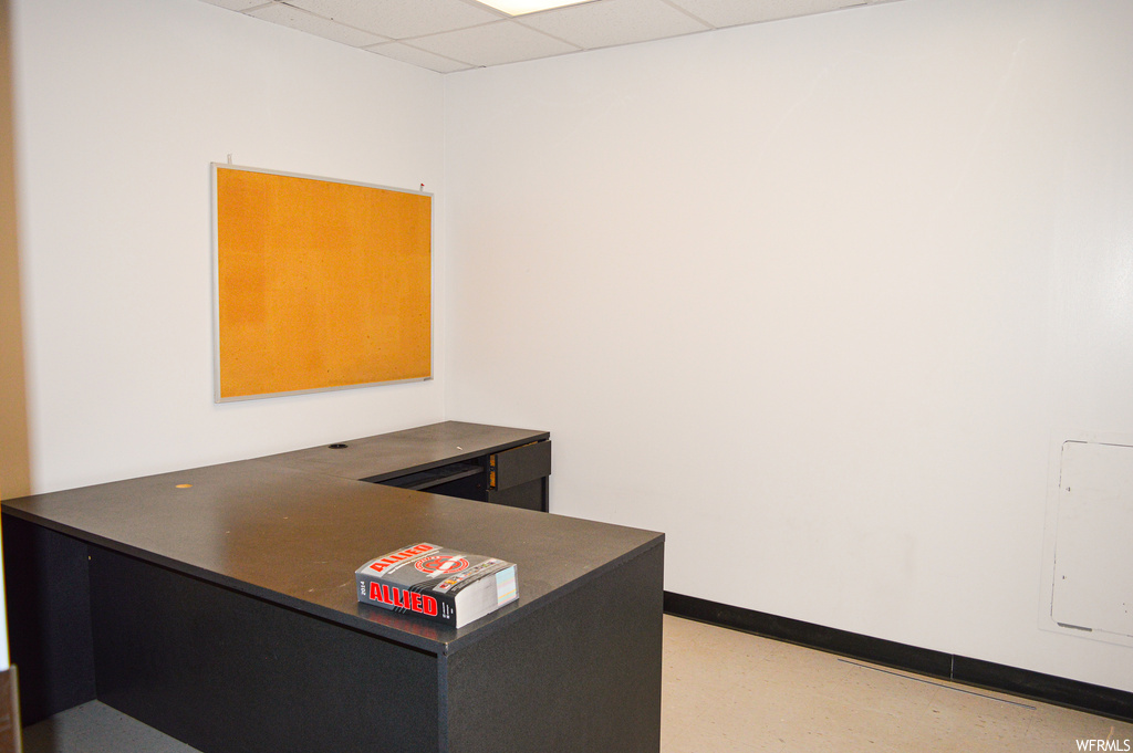 Home office featuring a drop ceiling