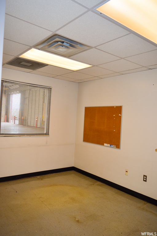 Spare room featuring a drop ceiling