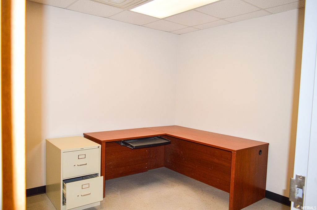 Tiled office with a drop ceiling