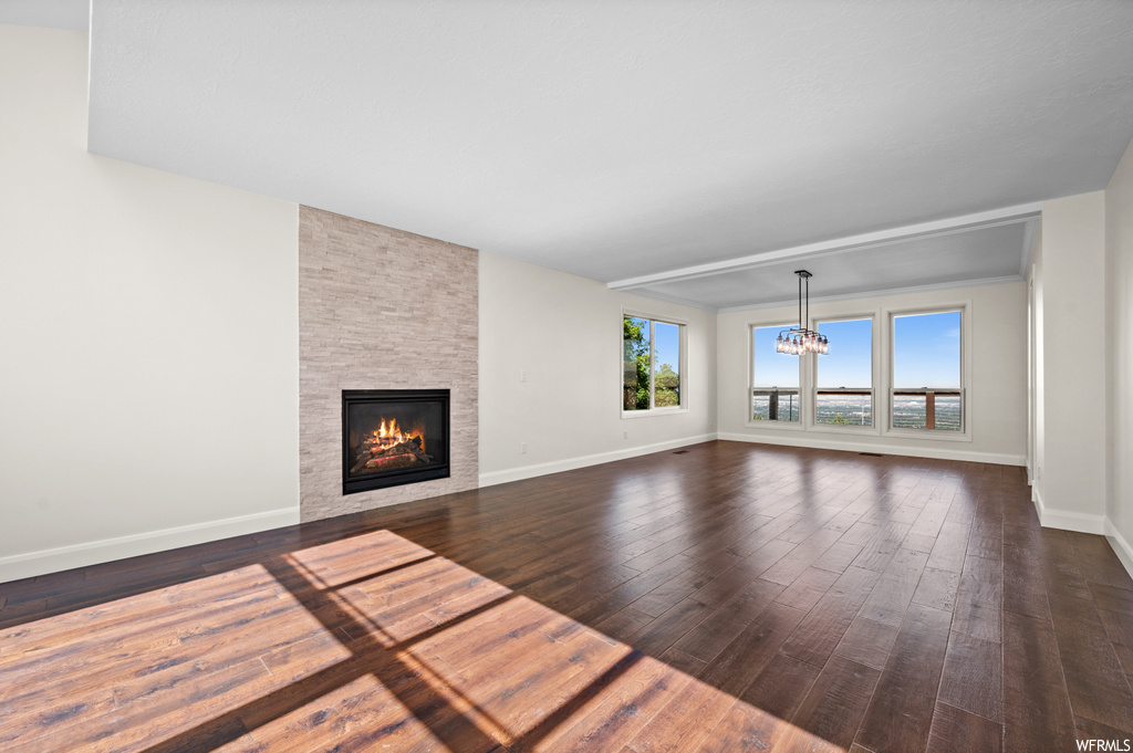 Living room with a fireplace and hardwood floors
