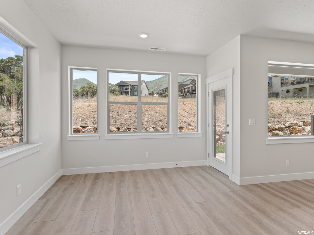 Sunroom / solarium featuring a wealth of natural light