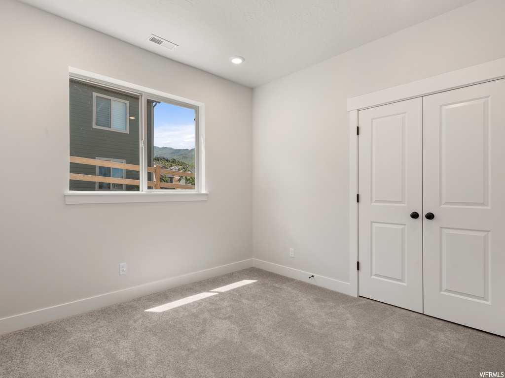 View of carpeted spare room