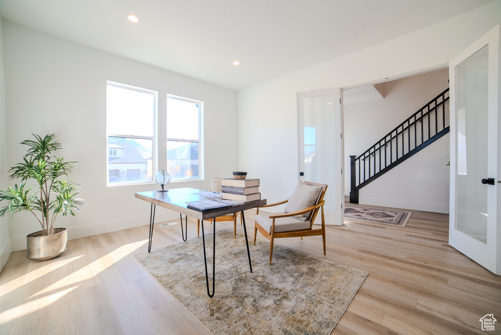 Office area featuring light hardwood / wood-style floors